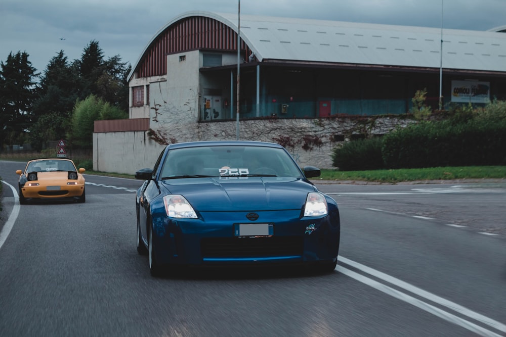 blue porsche 911 on road during daytime