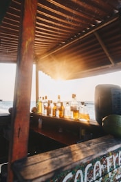 clear glass bottles on brown wooden table