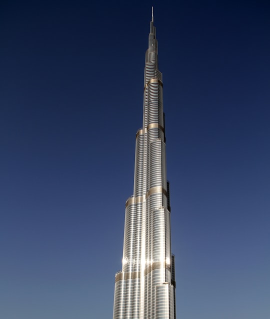 white and black tower under blue sky during daytime in Burj Park United Arab Emirates