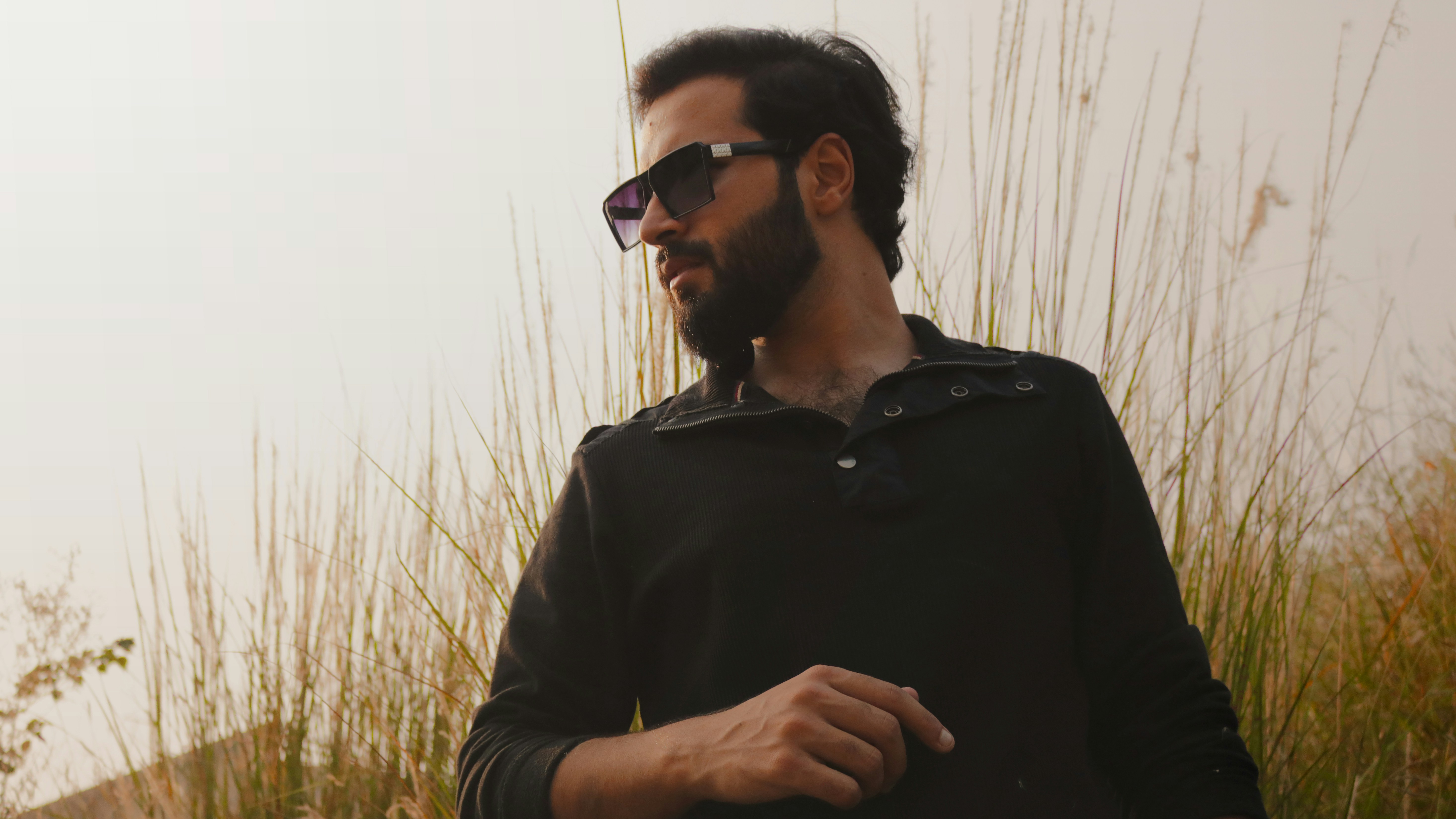 man in black dress shirt wearing black sunglasses