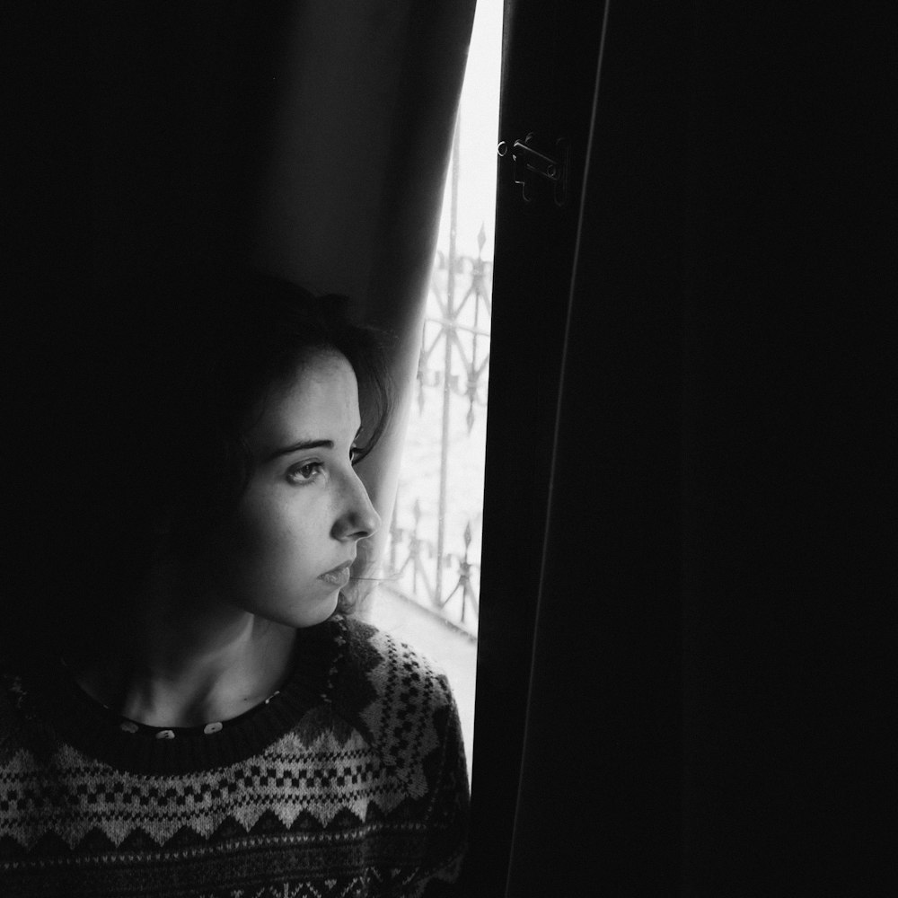 grayscale photo of woman in crew neck shirt