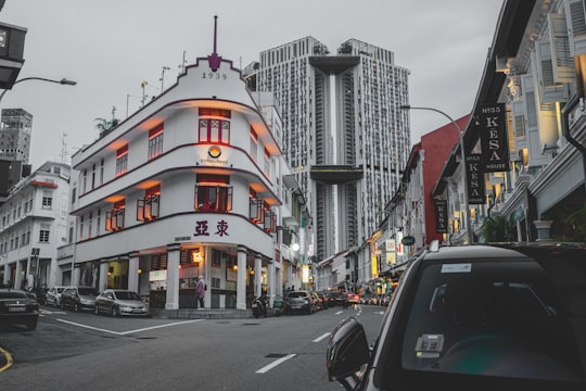 cars parked on street near building during daytime in Potato Head Singapore Singapore