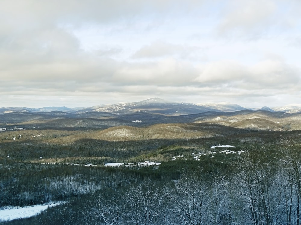 green and brown mountains under white clouds during daytime