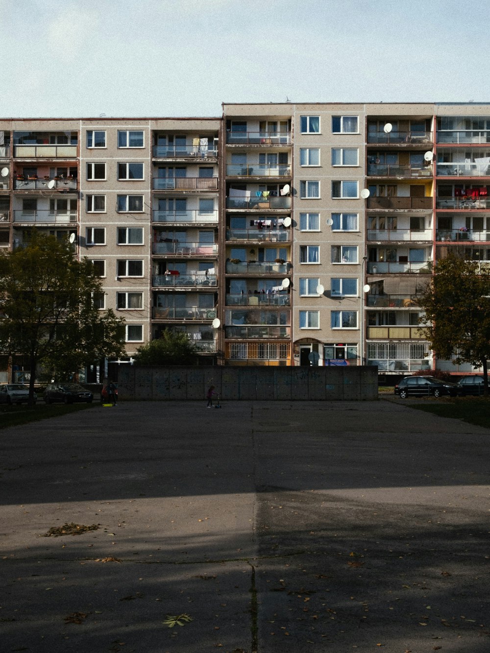 white concrete building near green trees during daytime