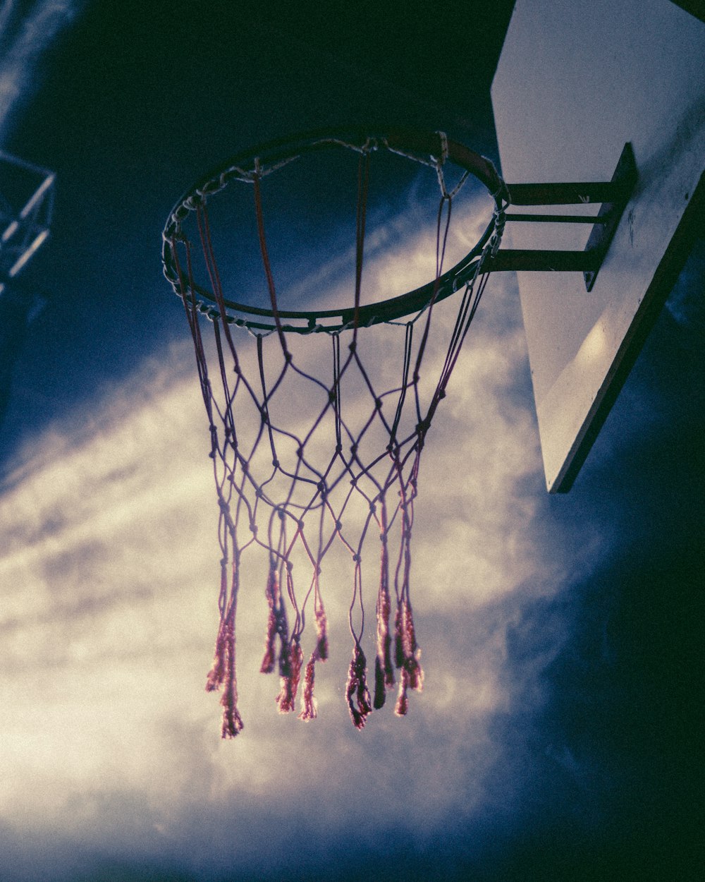 black basketball hoop under blue sky