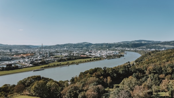 A panoramic view of Durgapur city skyline with industrial areas and nearby green landscapes.