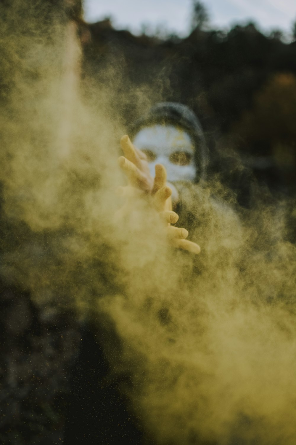 persons hand with smoke