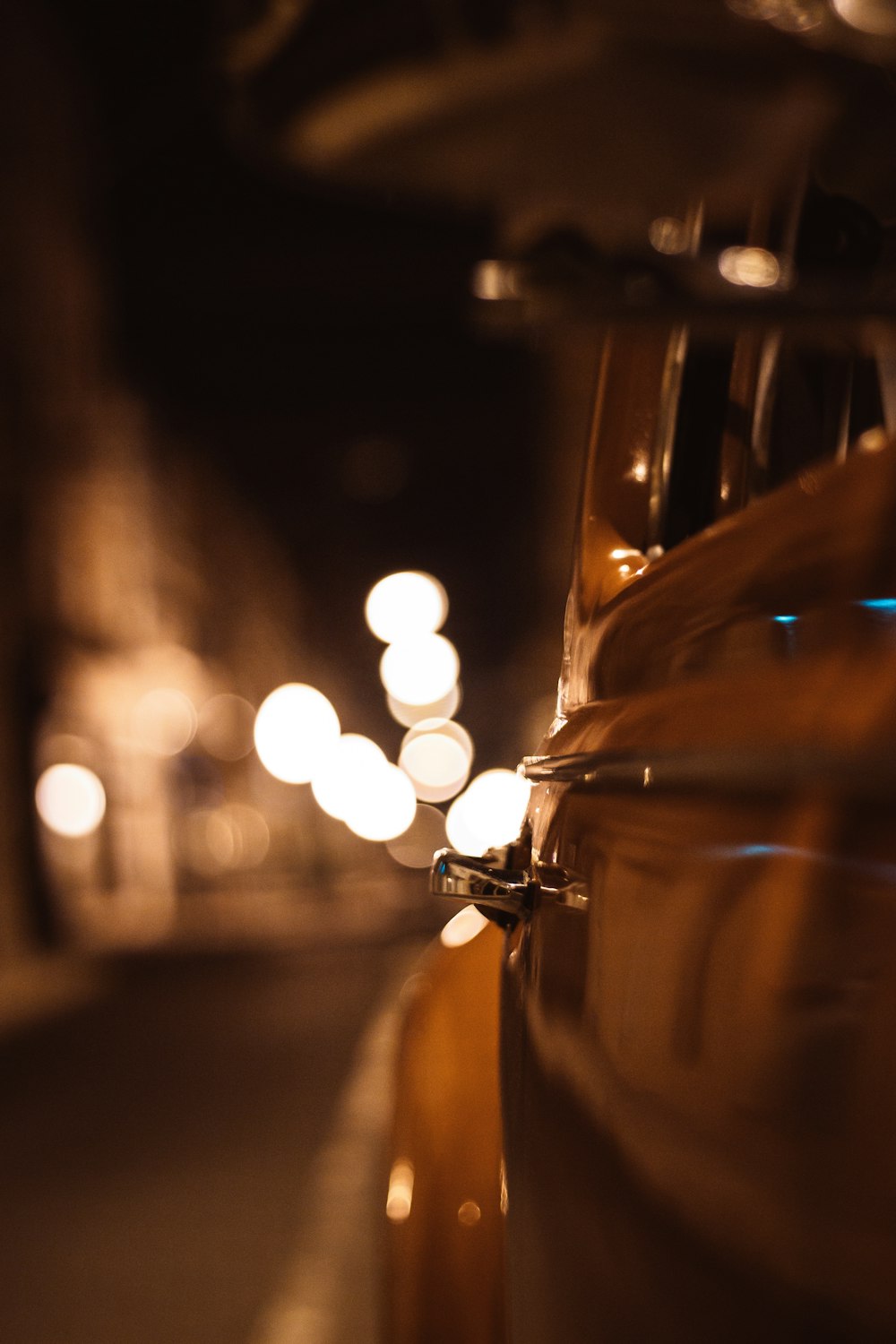 shallow focus photography of yellow car during night time