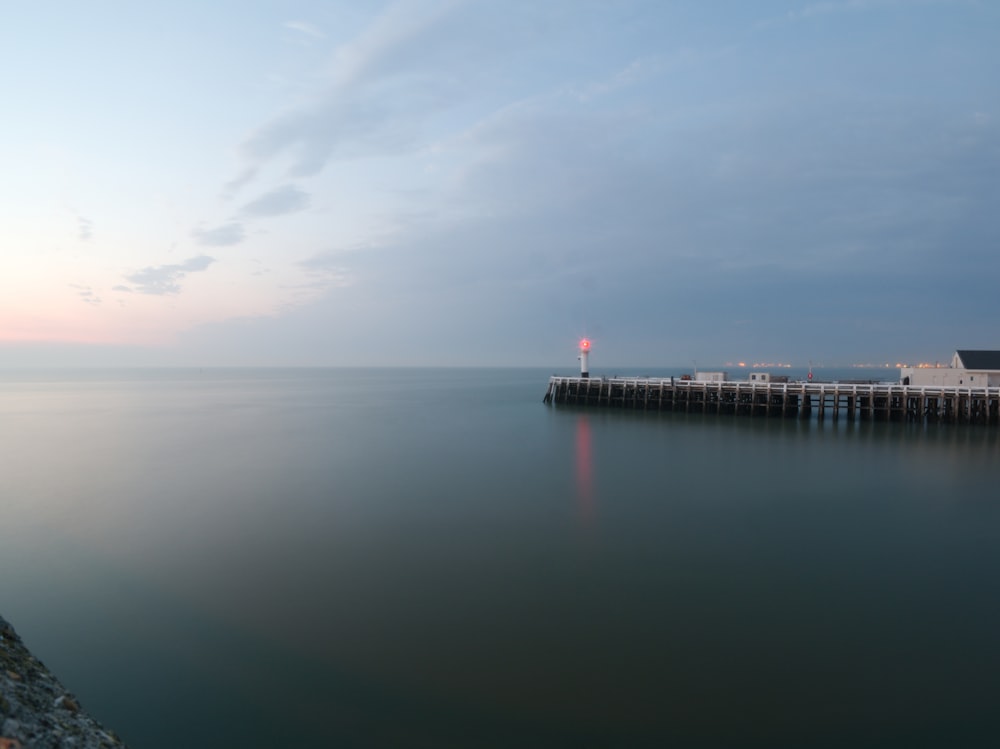 person standing on dock during daytime