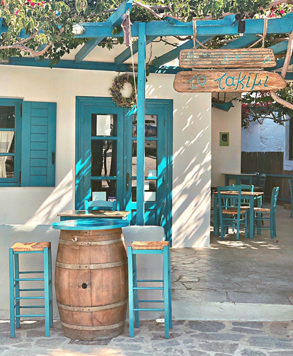 brown wooden barrel near blue wooden chair