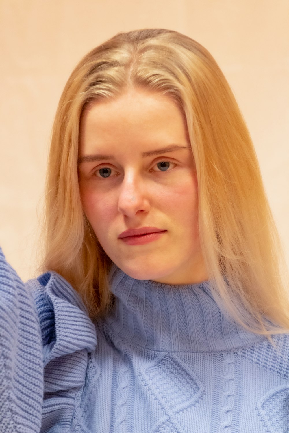 woman in blue turtleneck sweater