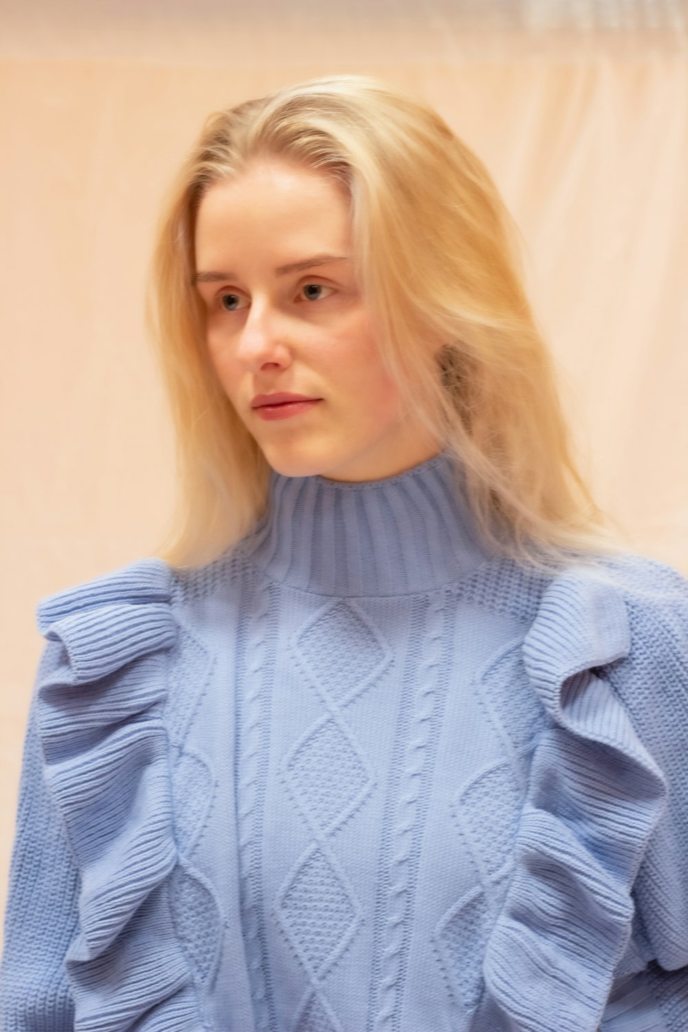 woman in blue knit sweater