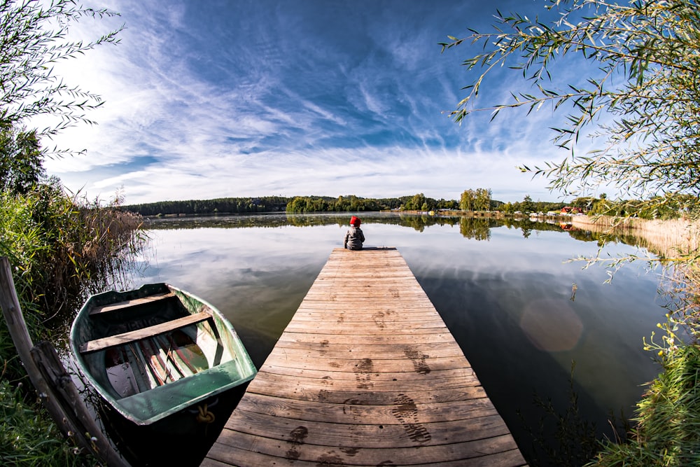 brown wooden dock on lake during daytime