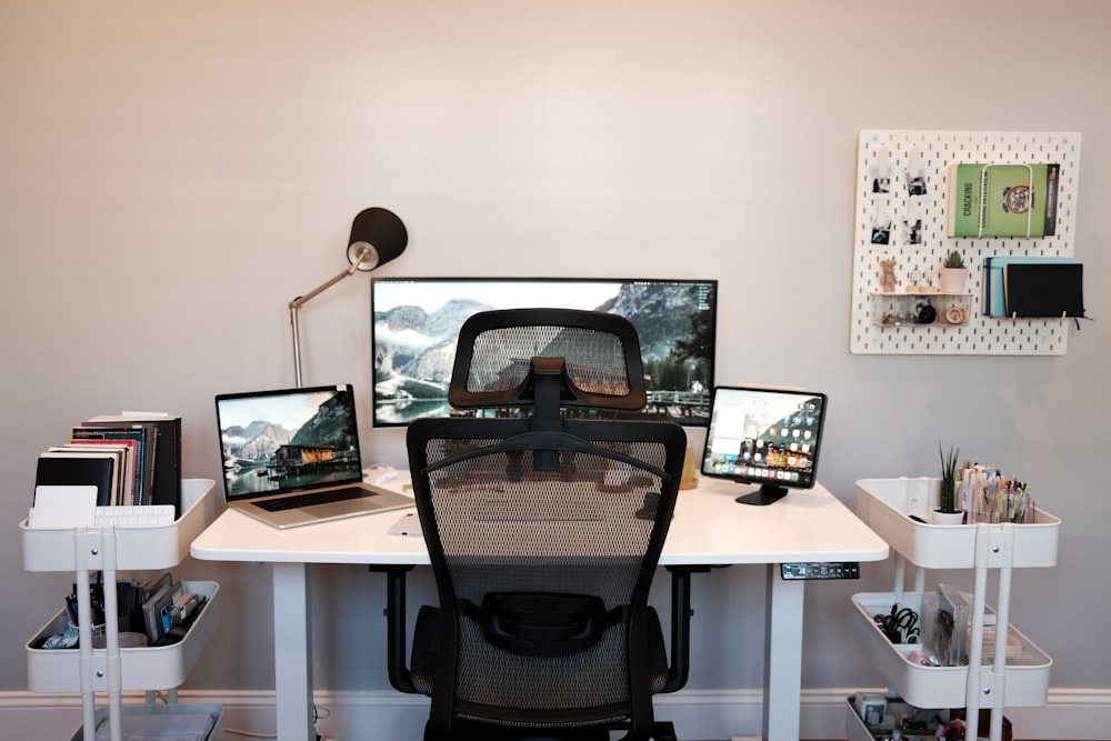 black flat screen computer monitor on brown wooden table