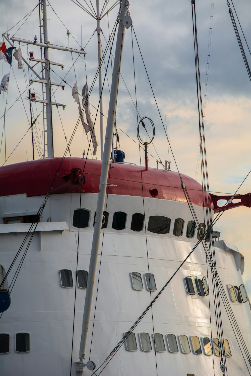 white and red boat on sea during daytime