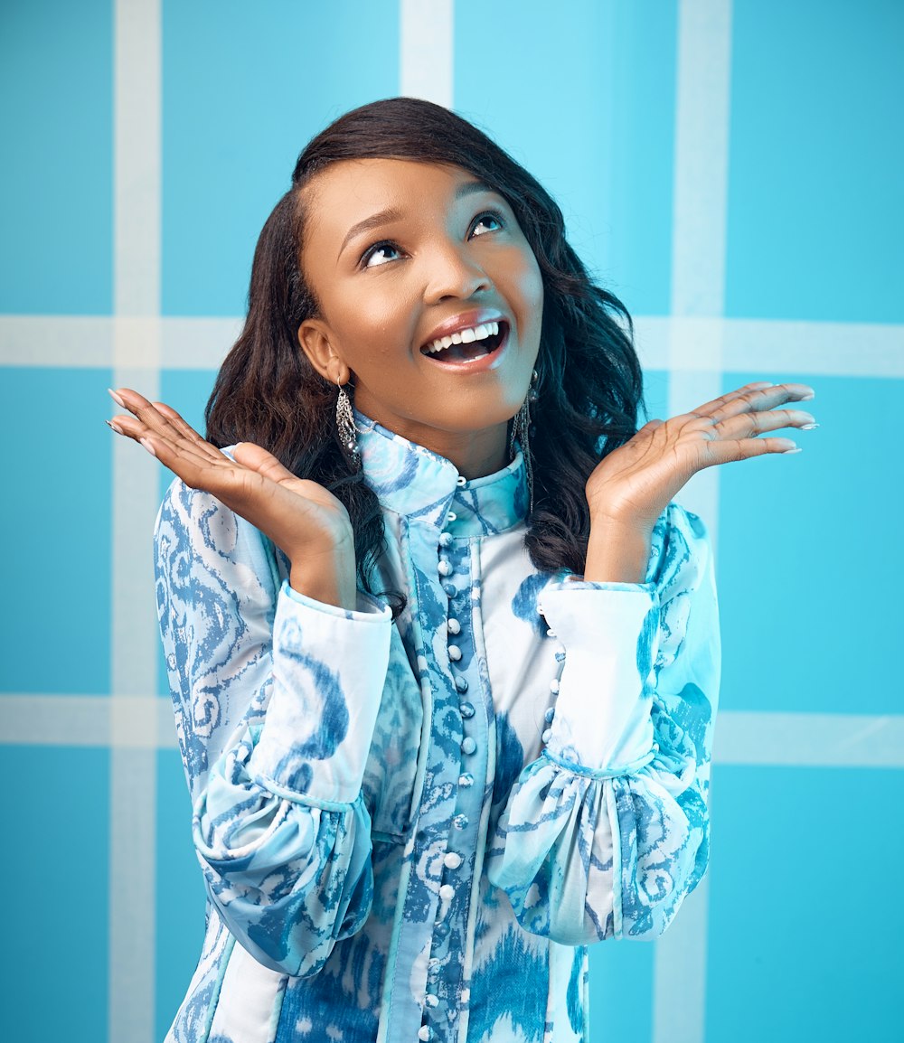 woman in white and blue floral button up long sleeve shirt