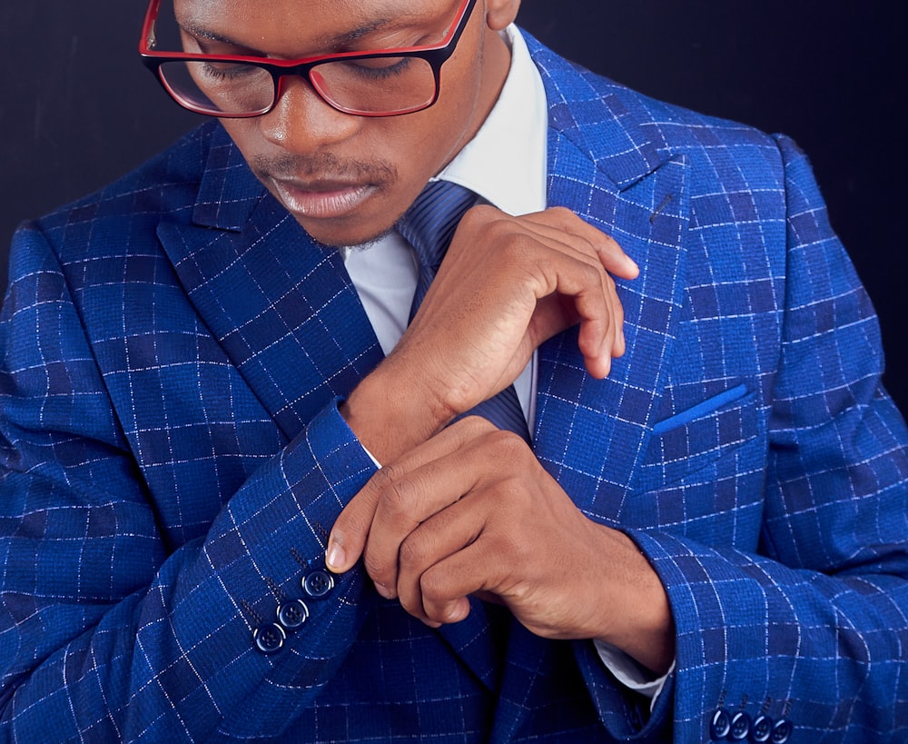 man in blue and white plaid suit jacket