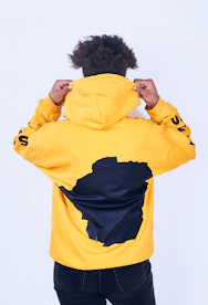 woman in yellow and black hoodie