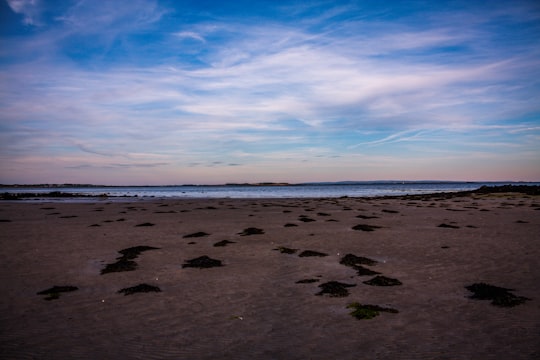 brown sand under blue sky during daytime in Galway Ireland