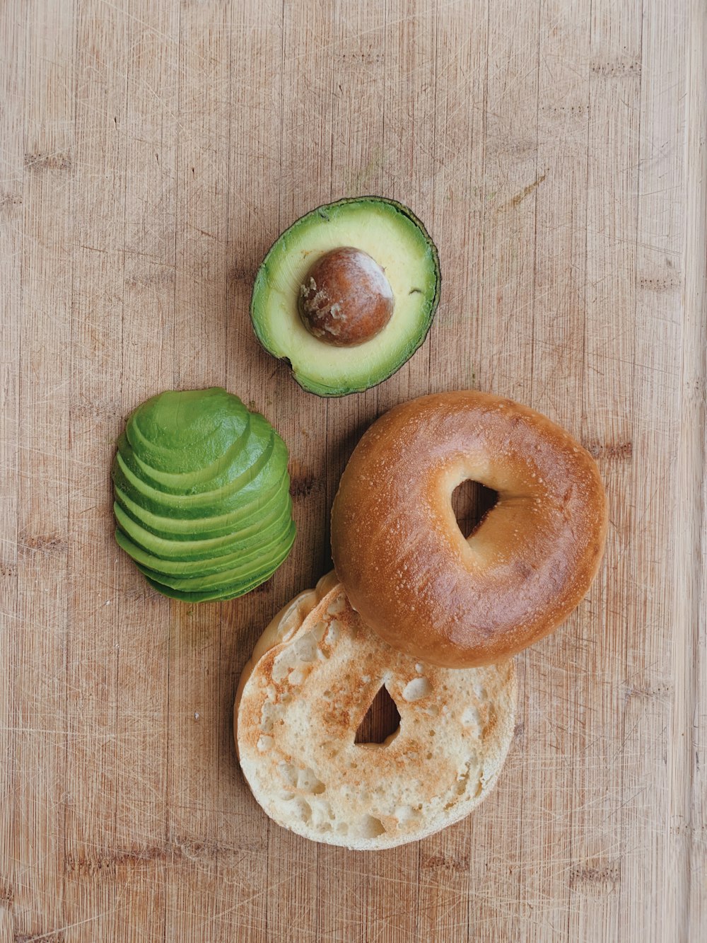 sliced cucumber on brown wooden surface