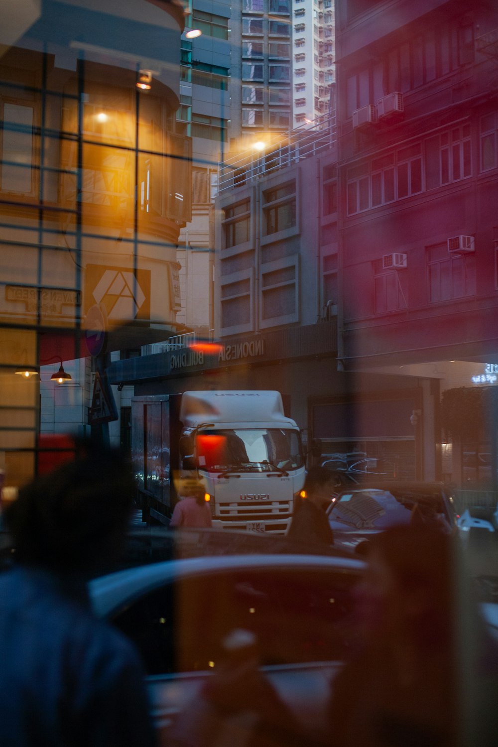 white van on road near building during night time