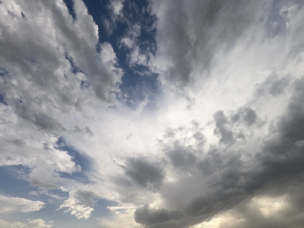 a cloudy sky is seen over a beach
