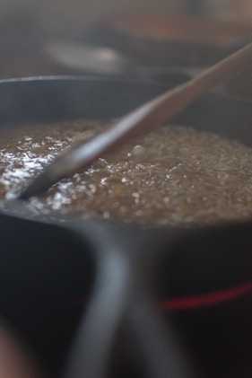 brown soup in black cooking pot