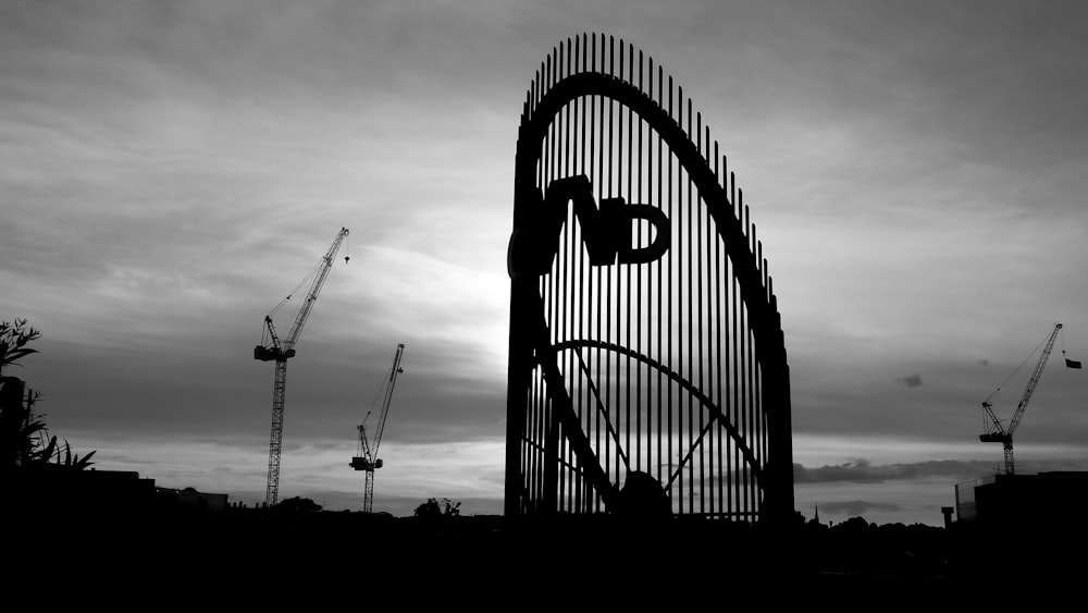 a black and white photo of a large metal structure