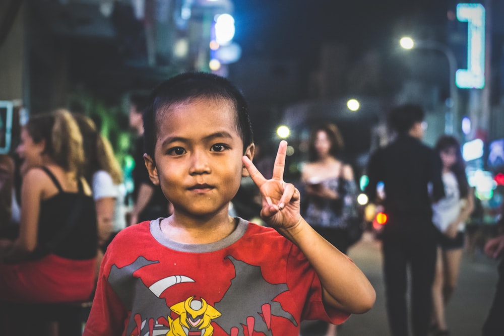 boy in red crew neck t-shirt