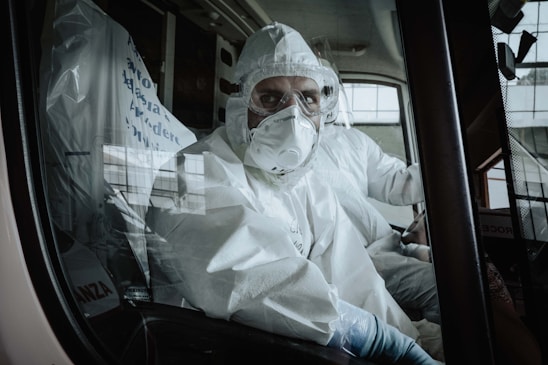 Courier in medical gear carefully transporting a secure container labeled for organ transport.