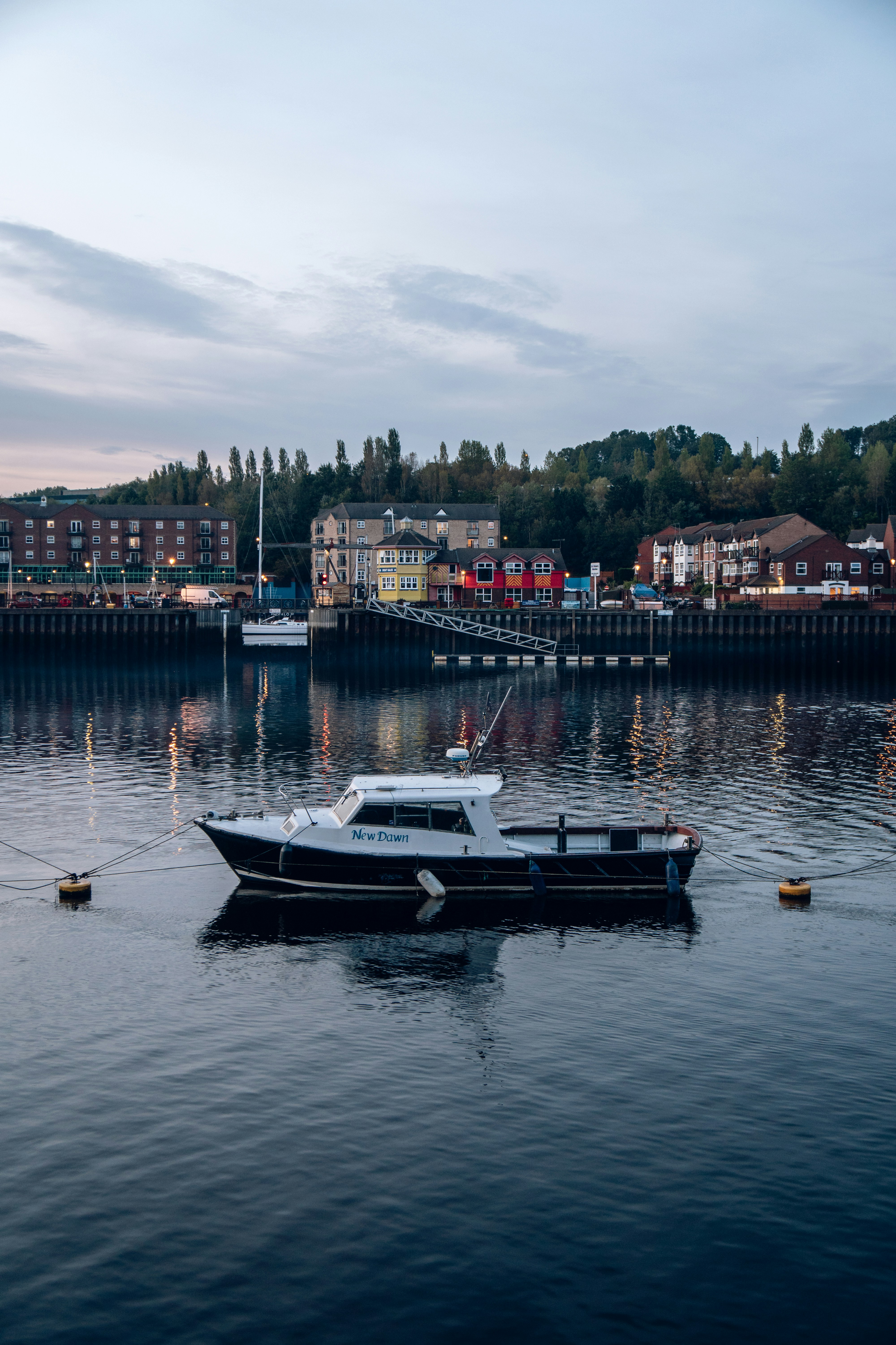 white and blue boat on water during daytime