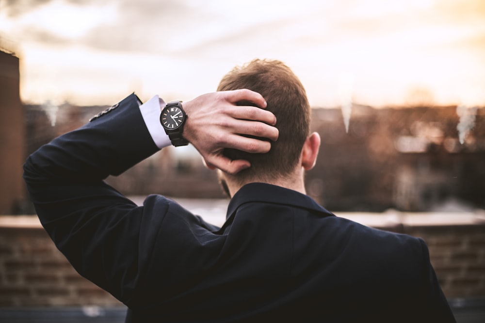 man in black long sleeve shirt wearing black watch