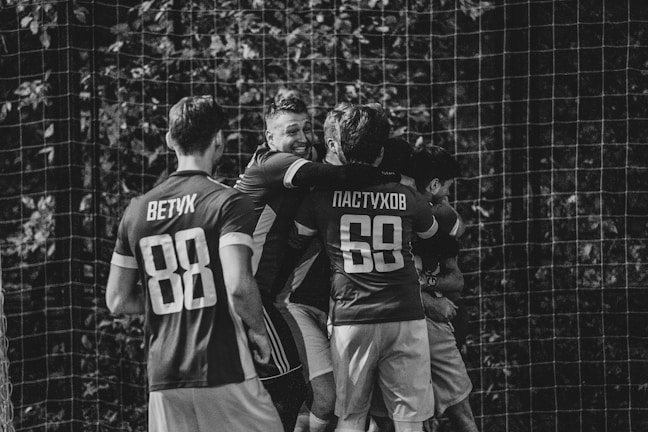 A joyful moment of a child celebrating a goal with friends.