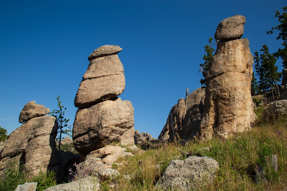 brown rock formation under blue sky during daytime