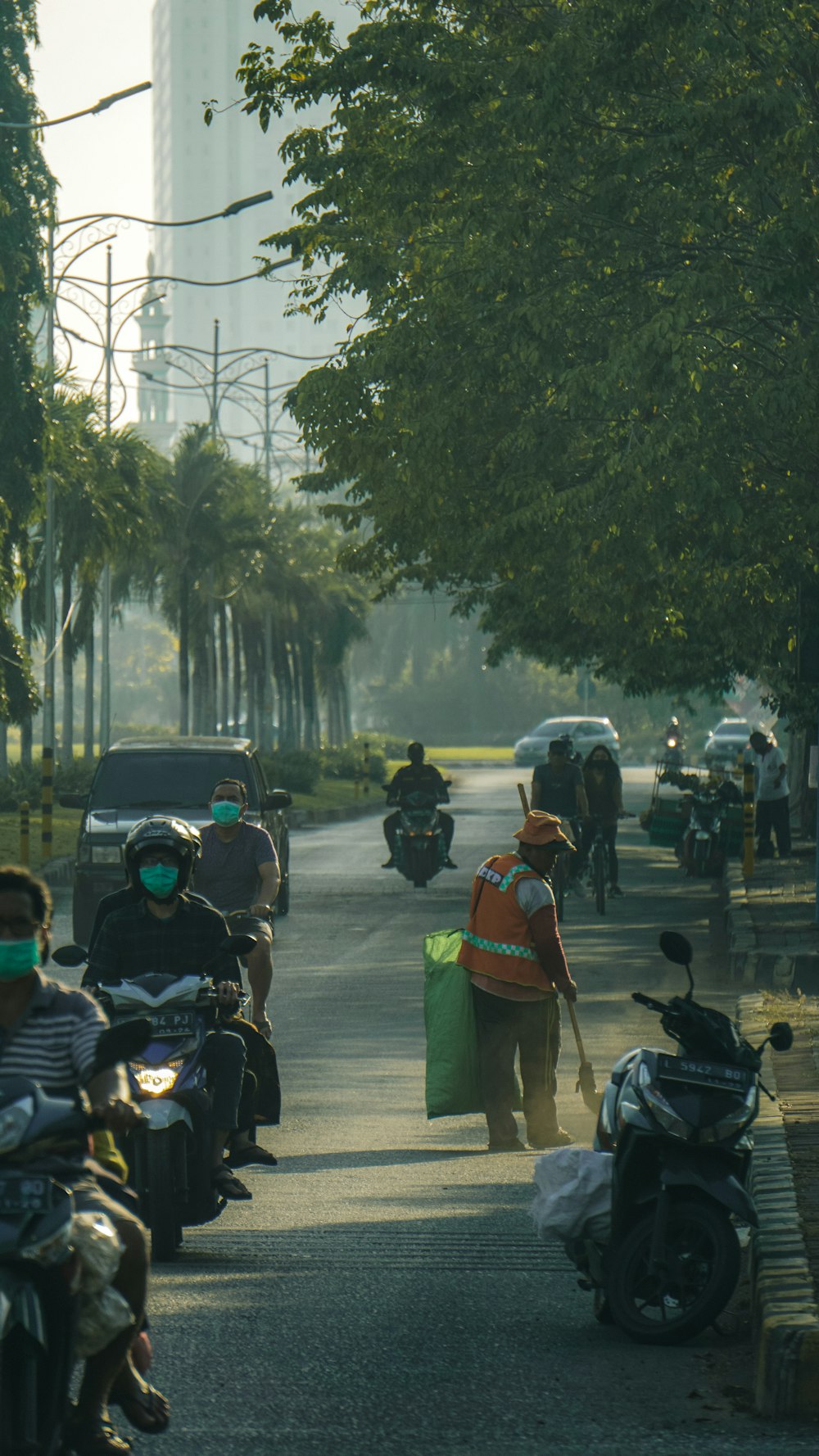 people riding motorcycle on road during daytime