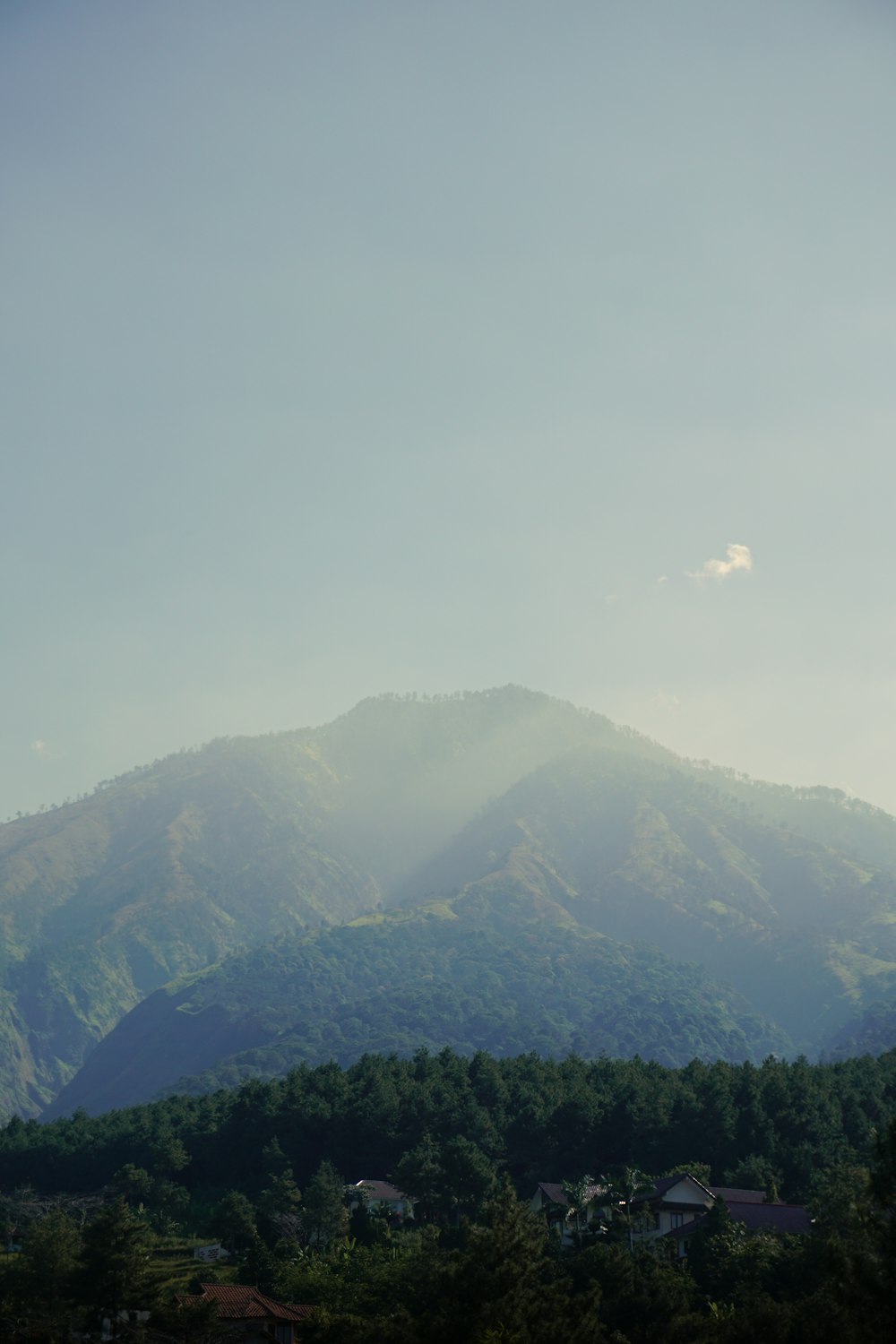 green mountains under white clouds during daytime