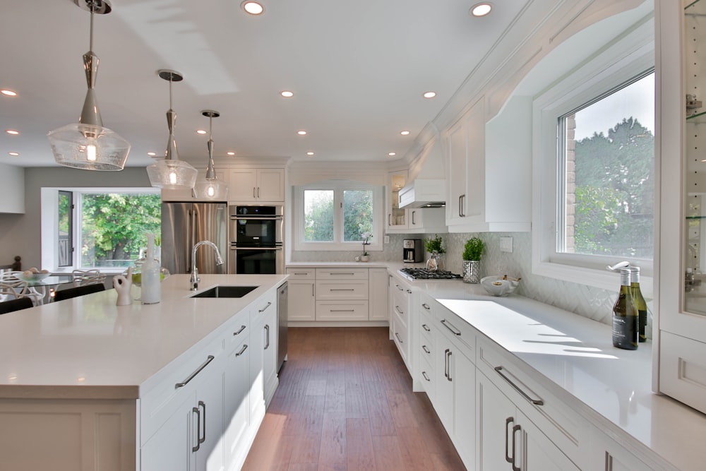 white wooden kitchen cabinet with kitchen sink