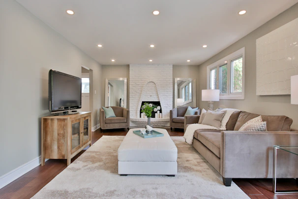 Comfortable living room with a large screen TV and a modern fireplace creating a welcoming atmosphere.