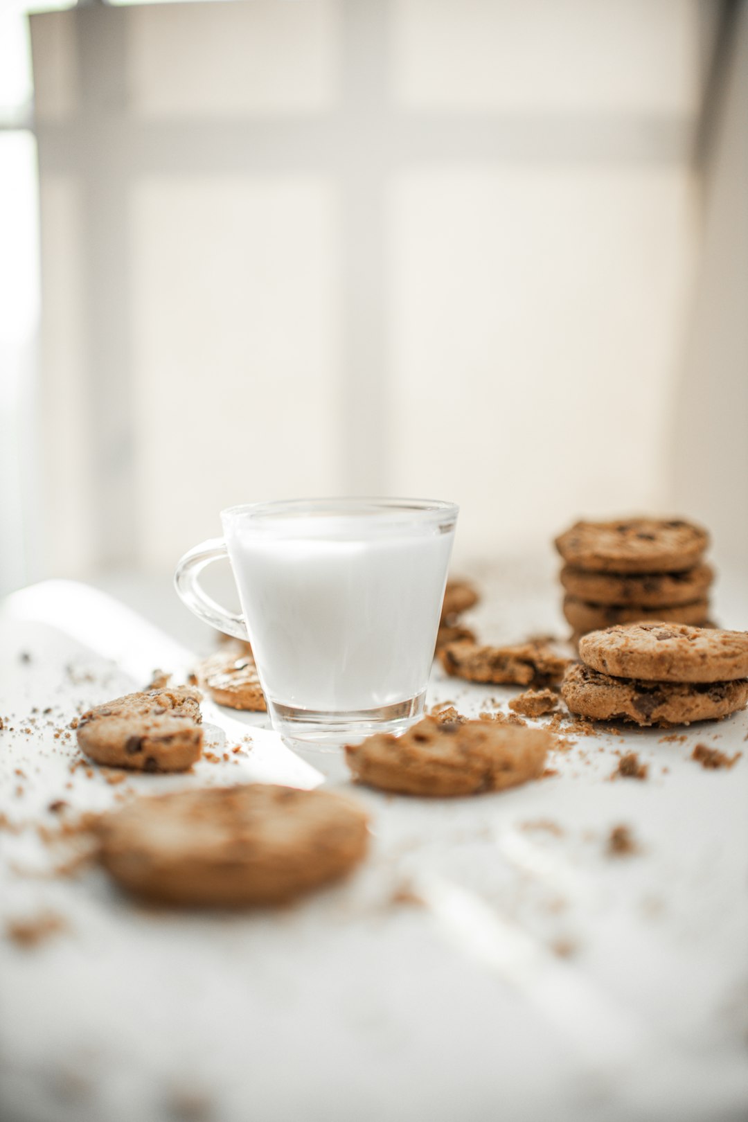 cookies and milk in clear drinking glass