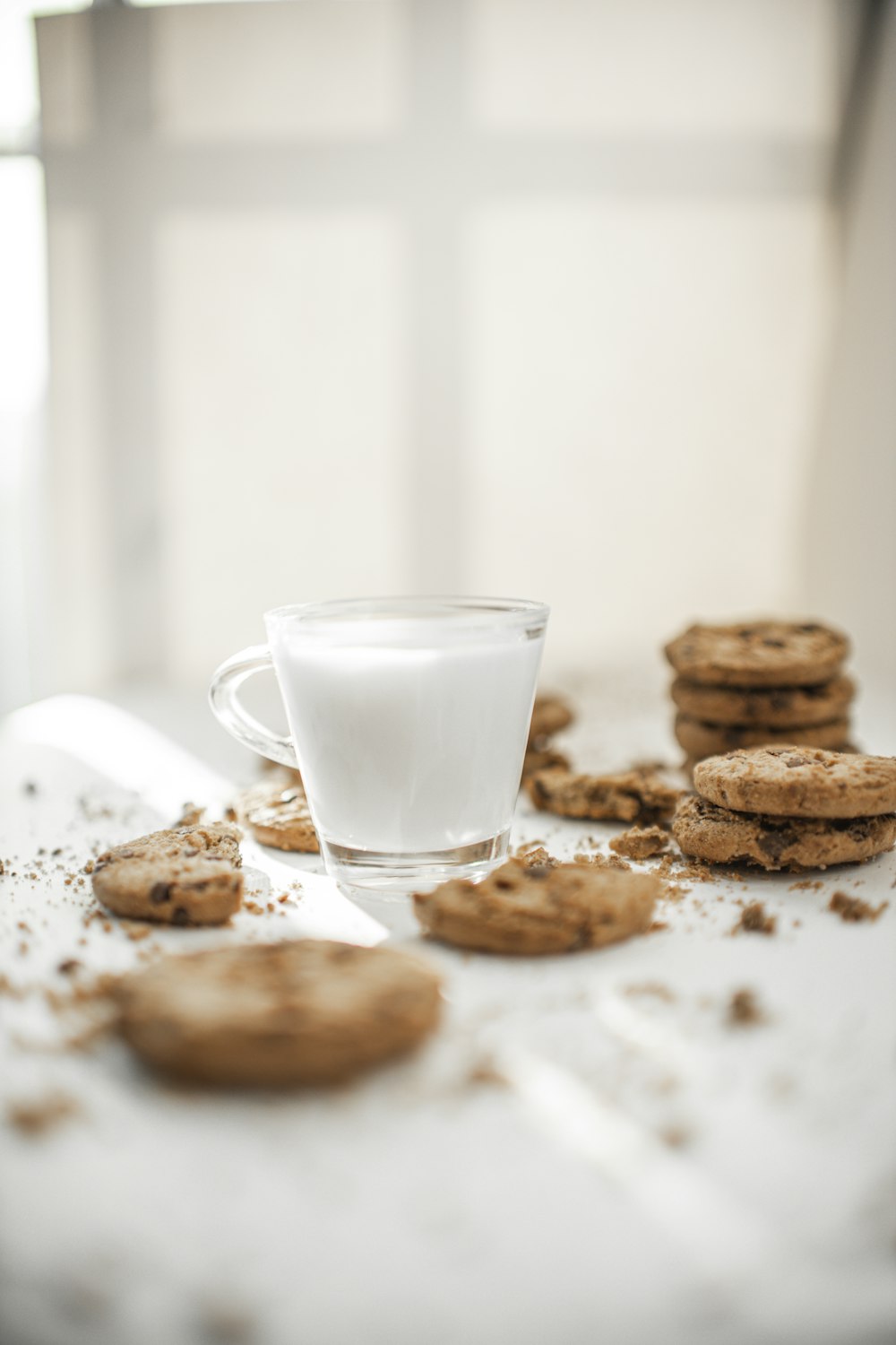 cookies and milk in clear drinking glass