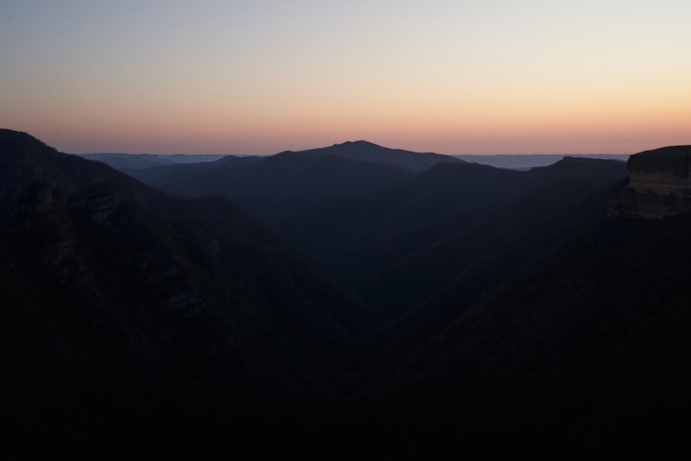 silhouette of mountains during sunset