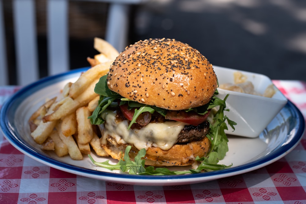 burger with lettuce and tomatoes on white ceramic plate