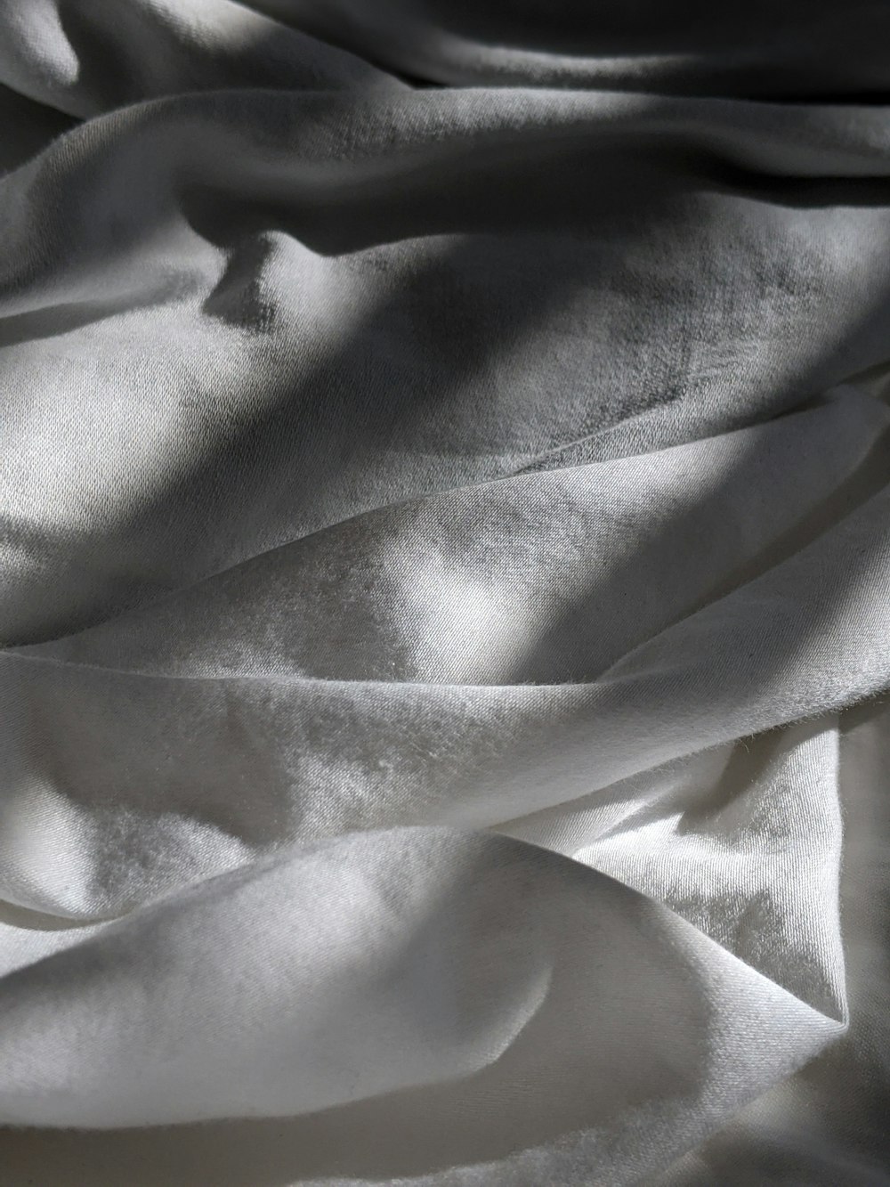 gray textile on brown wooden table