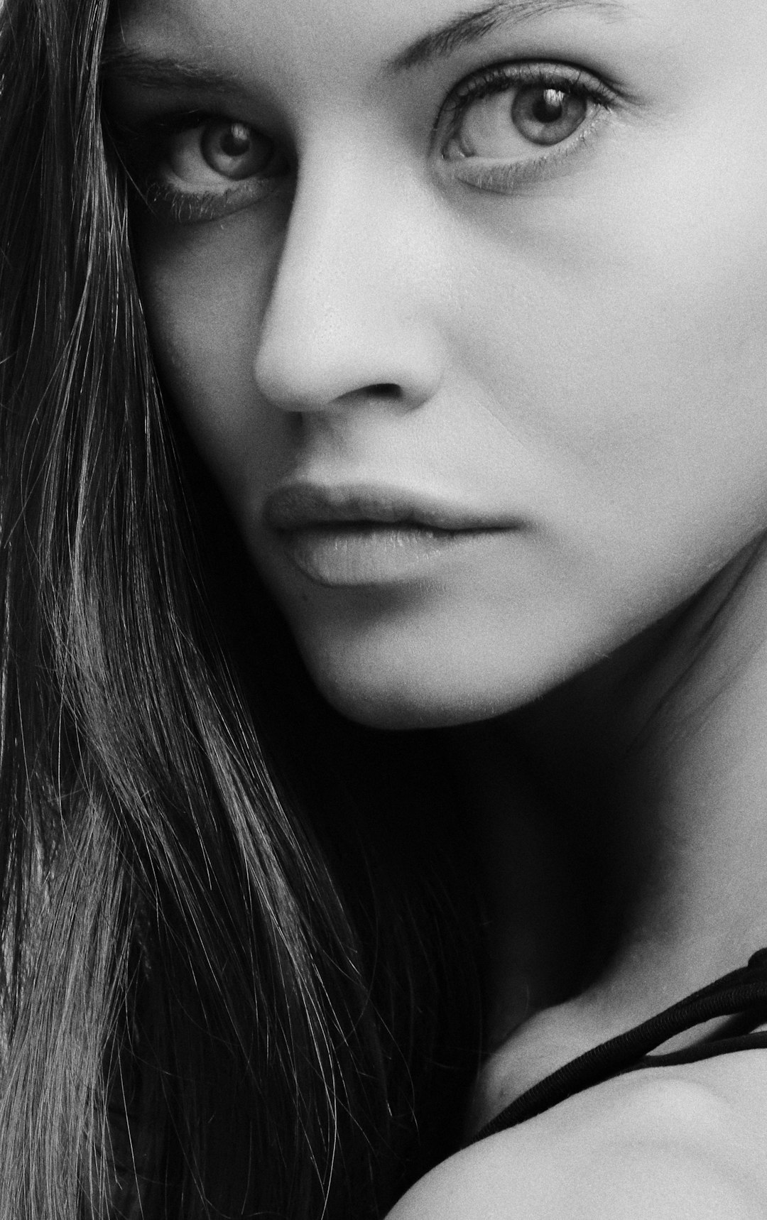 womans face in grayscale