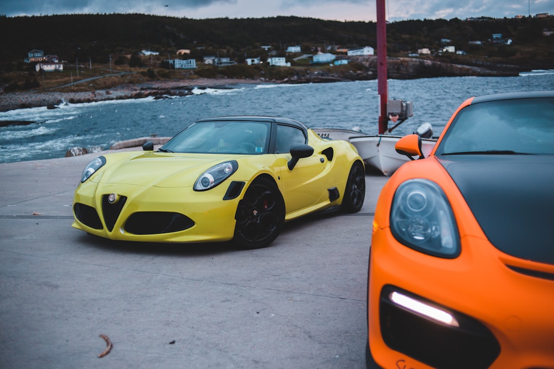 yellow ferrari 458 italia on beach during daytime