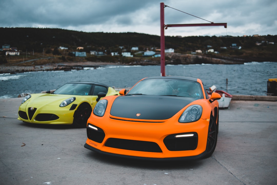 orange lamborghini aventador on gray asphalt road during daytime