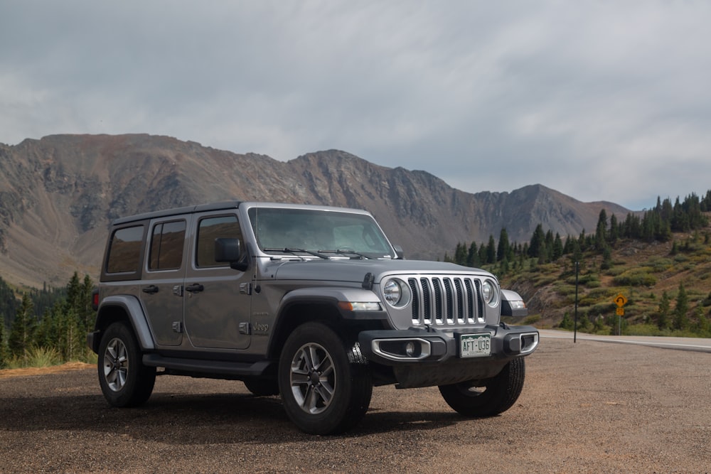 black jeep wrangler on dirt road during daytime