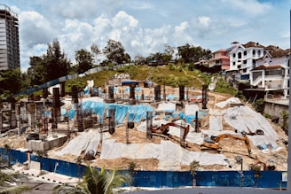blue swimming pool near green trees during daytime