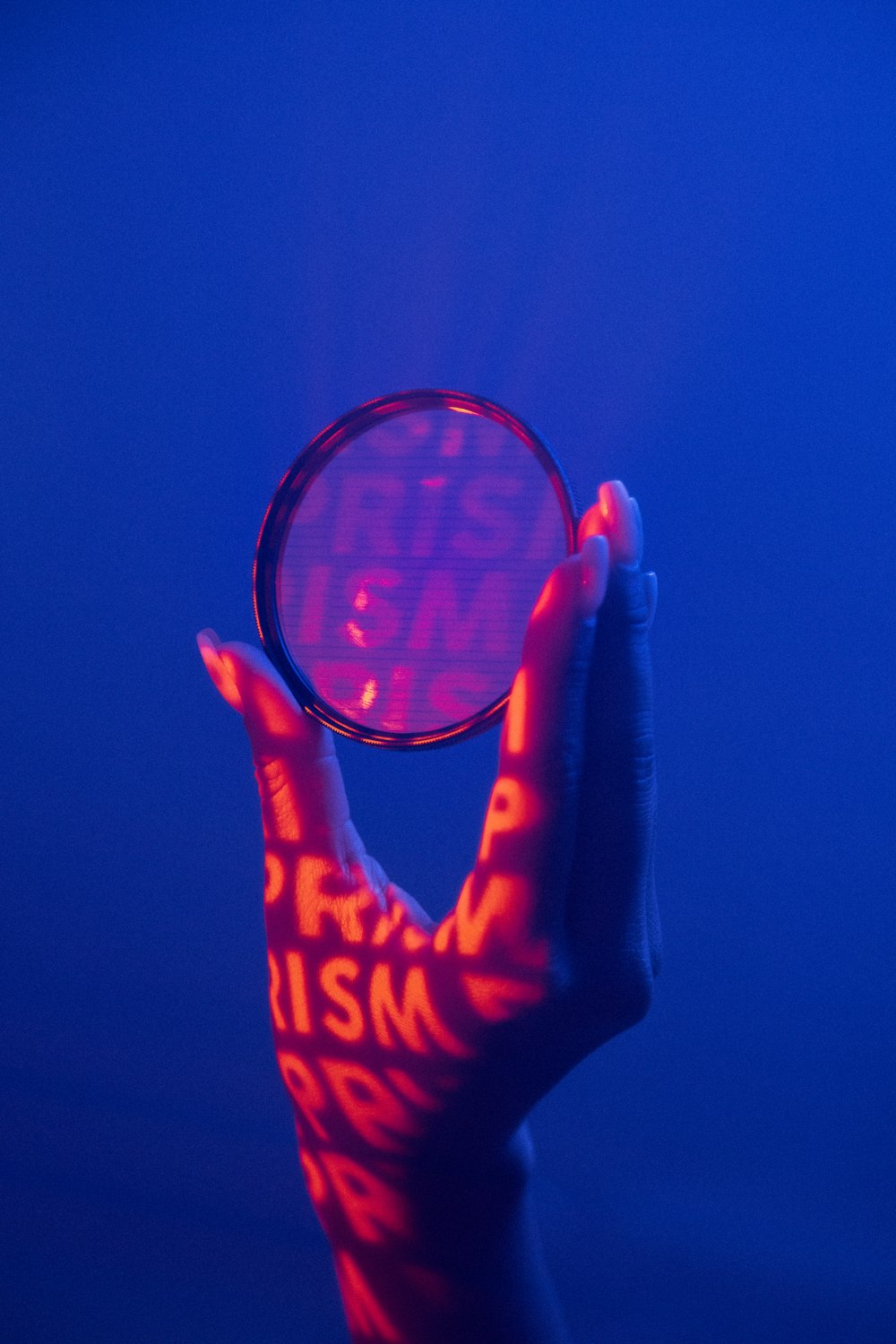 person holding red and black basketball hoop