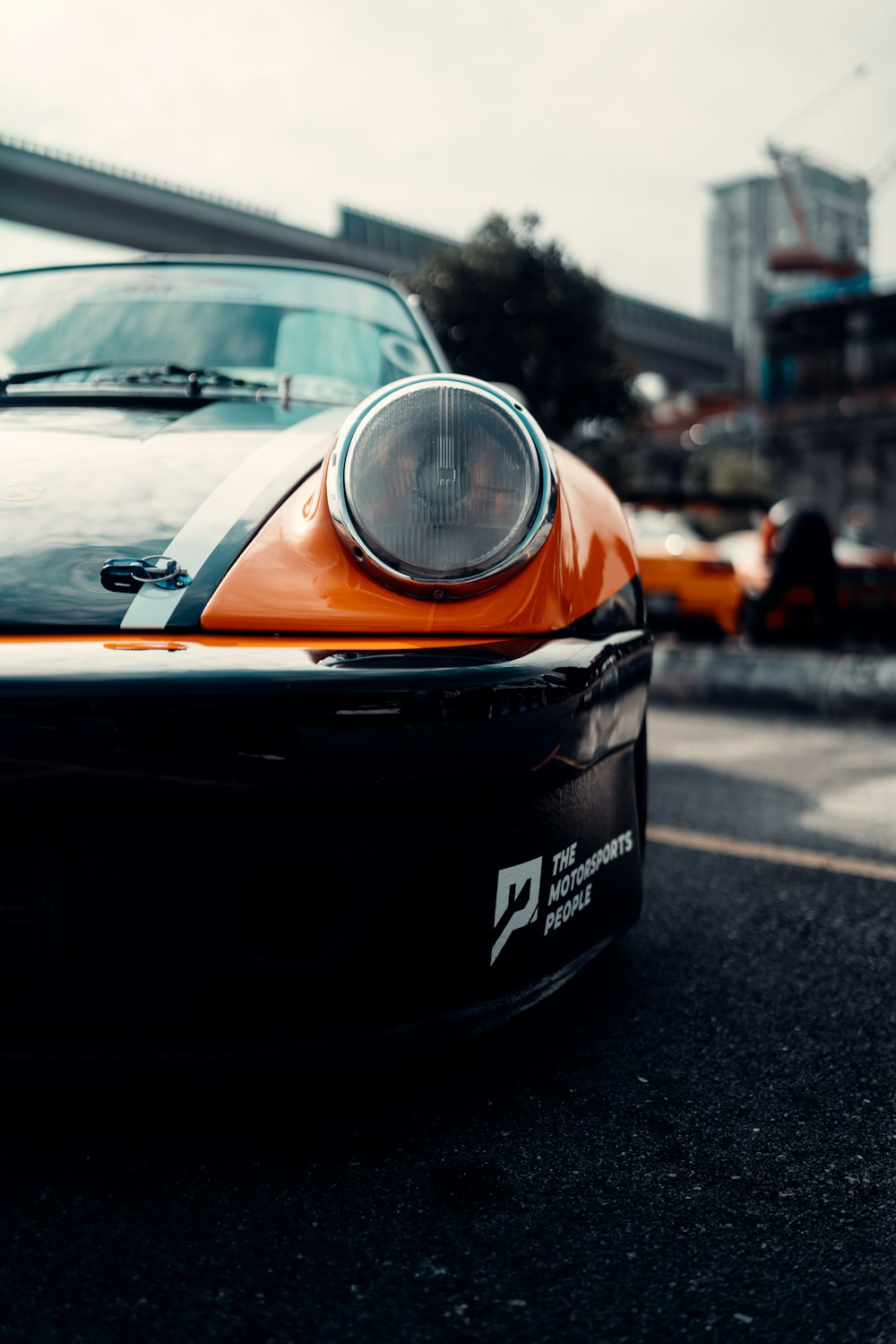 black and orange car on road during daytime